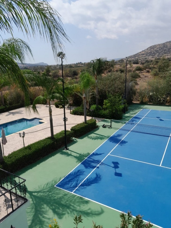 photo of the tennis field with the pool