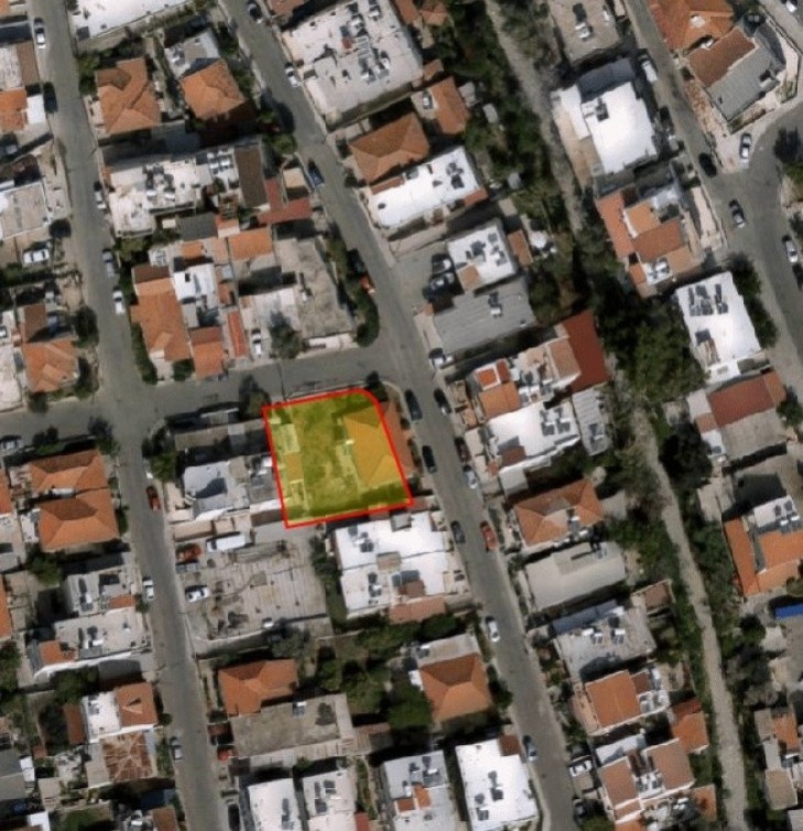 Aerial picture of the residential plot, having a house and garden in it.