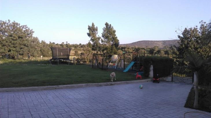 Picture of the large garden area and the lovely playground area of the five-bedroom villa