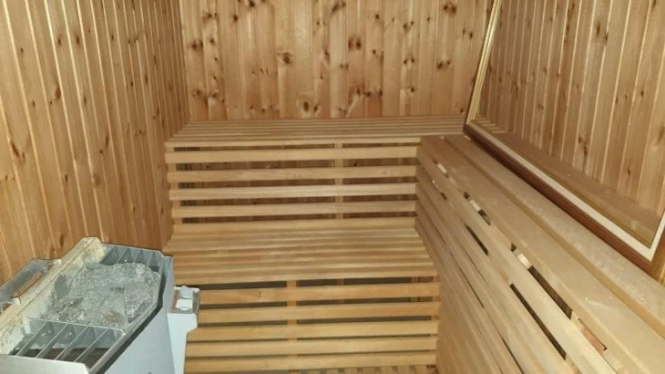 The property is equipped with a sauna room